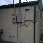 Exterior electrical panel, with wires connected from the box to the home’s electrical system