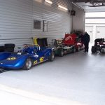 A garage condo with two cars parked