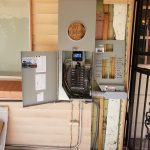 Open electrical box displaying the wiring and electrical board, with circuit breakers installed