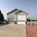 a building with two prominent garage doors