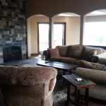 living room featuring with fireplace and various furniture pieces