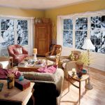 Cozy living room with winter scenery outside large windows