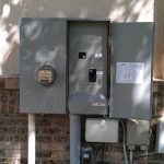electrical boxes attached on the exterior wall of a home