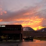 sunset view of the mountains behind FirstBank building