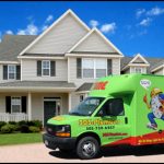 Time Plumbing service truck in front of a house