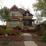 small house with yellow and brown paint