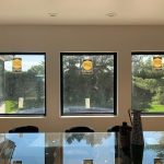 large glass windows overlooking the yard