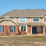 front exterior of a large country-style house