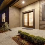 double entry front door of a house at night