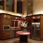 rustic kitchen with wooden cabinets and stainless steel appliances