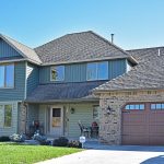 House with classic vinyl siding in cypress color