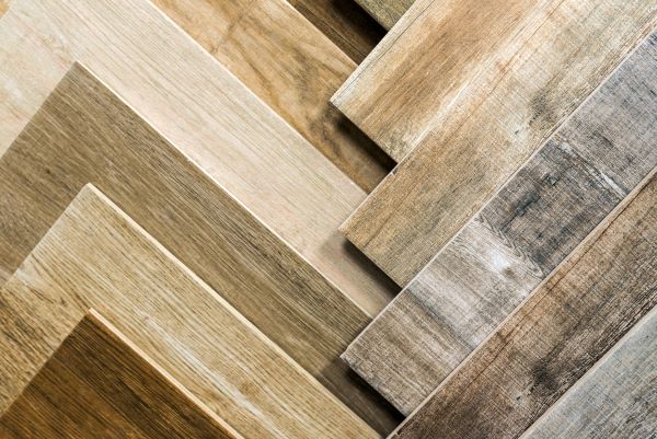 stack of different shades of wood flooring