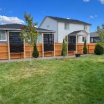 spacious residential yard with privacy fence
