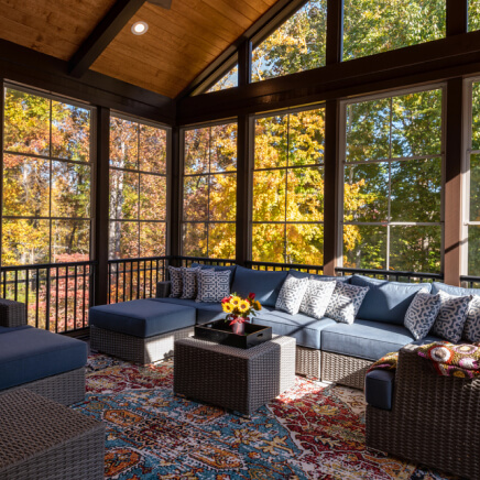 cozy-screened-porch-contemporary-furniture-flower-bouquet-vase-autumn-leaves
