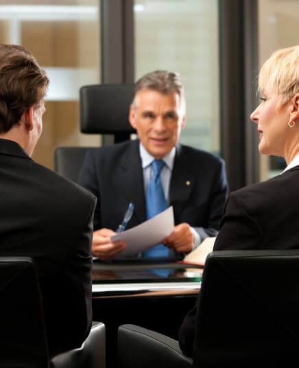 img - lawyer-or-notary-with-clients-in-his-office