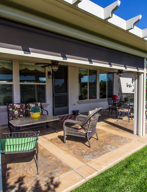 Concrete patio at the back of a house
