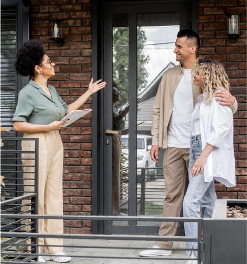 positive african american property realtor folder showing contemporary cottage happy