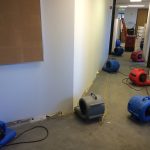 multiple industrial-grade air blowers in the hallway