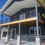 Two-story residential building featuring a prominent gutter system
