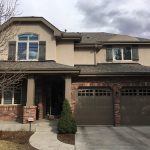 house facade with a garage with two separate car bays