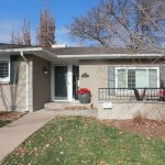 concrete walkway guiding to the house entrance door