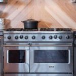 covered pot on a double oven gas range