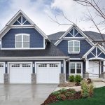 Exterior of a house with newly installed windows and siding