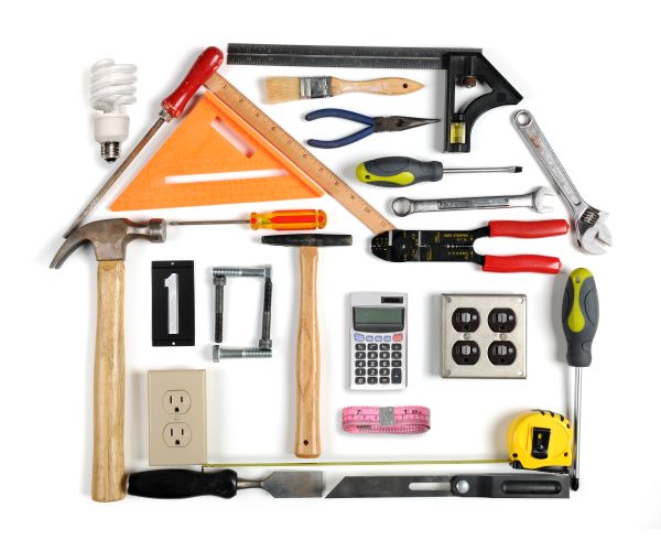 home construction and repair tools formed into a house shape