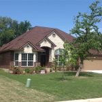 A roof featuring TAMKO Heritage Rustic Redwood Architectural Shingles