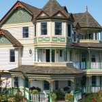 Victorian-style house with turret, wraparound porch, and ornate trim