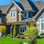 facade of a large house with frontyard landscape