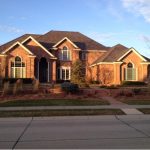 A large, single-family house with prominent roof structure