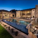 large glass enclosed outdoor pool of a luxurious home