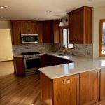 kitchen features wooden cabinets, likely made of maple