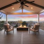 covered deck with a firepit, and chairs, overlooking the mountains