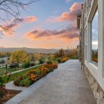 outdoor hallway with garden landscaping overlooking the mountains