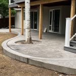 A concrete patio with a curved design