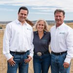 three people smiling