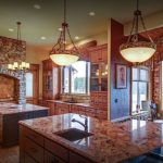 rustic style kitchen with stone brick walls