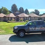 Performance Roofing service car on the street