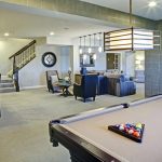 Basement with billiard table and chairs