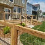 wooden fence with a matching railing and gate