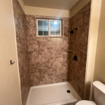 shower area with no curtain nor door